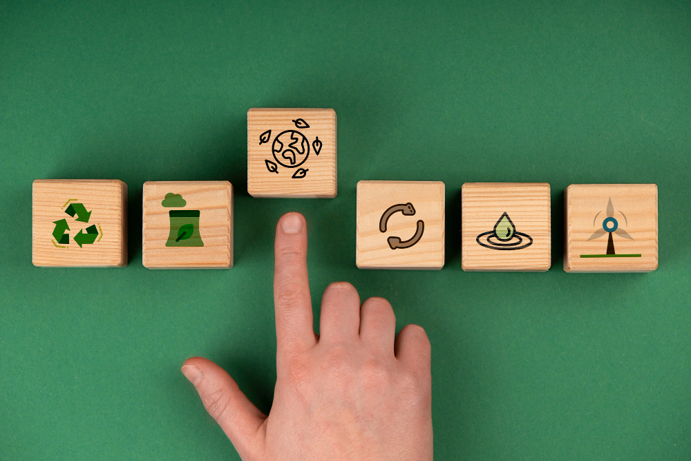 Imagem de uma mesa com elementos representando os Objetivos de Desenvolvimento Sustentável (ODS), incluindo uma planta, pedras e outros objetos naturais. A imagem transmite a ideia de sustentabilidade e responsabilidade ambiental, fundamentais no combate às mudanças climáticas.